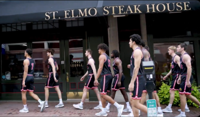 basketball players walking on a street